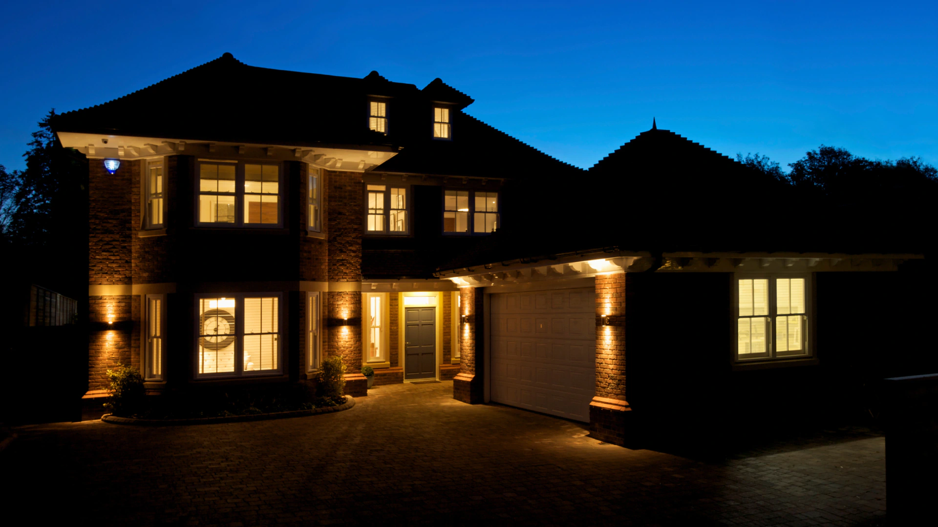 residential house with exterior lights during night